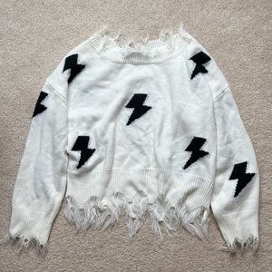 Fringed White Sweater with Black Lightning Bolts